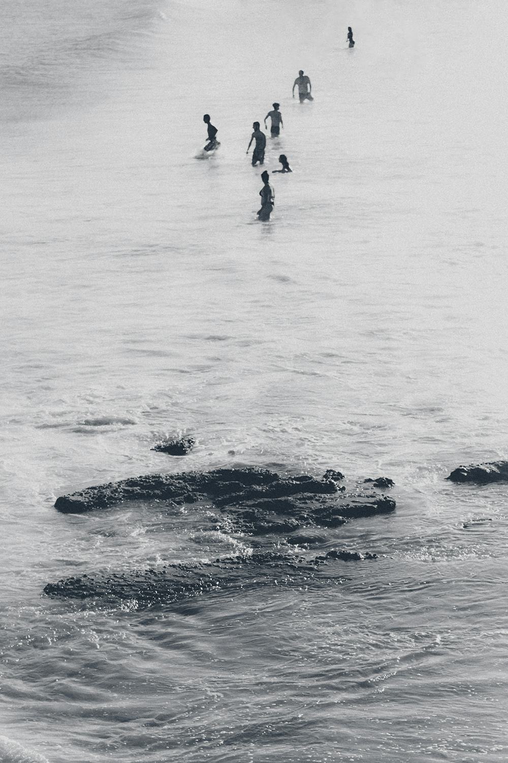 people swimming in the sea