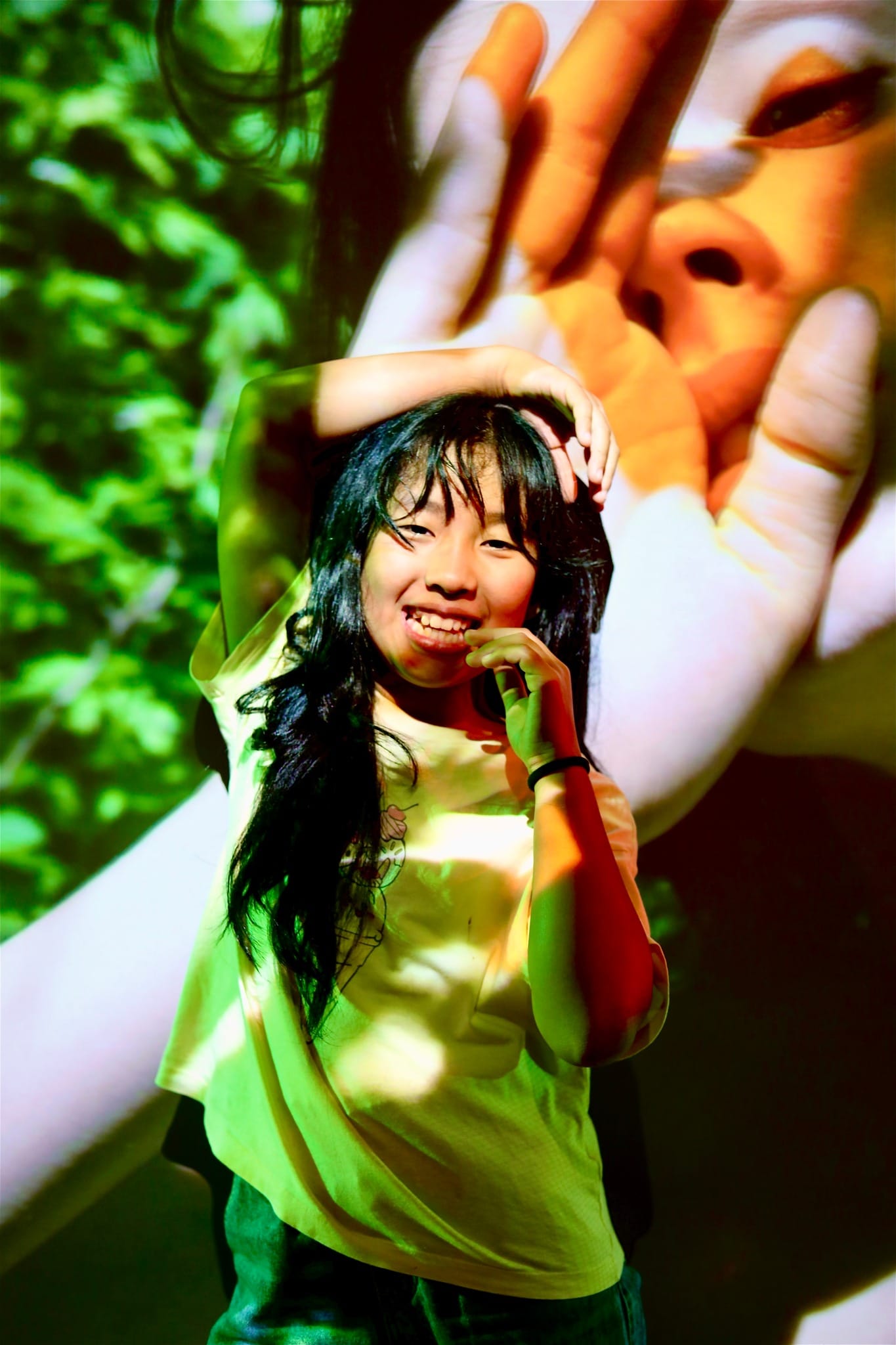 Image of a child looking into the camera smiling during a festive photography event