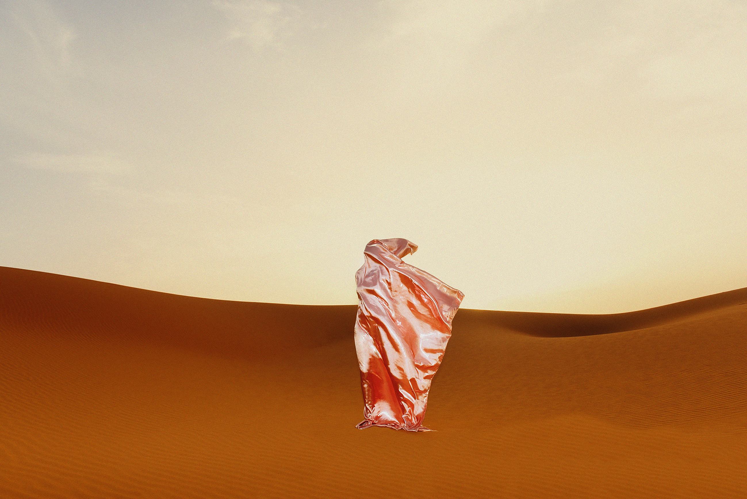 Woman with hijab in the dessert