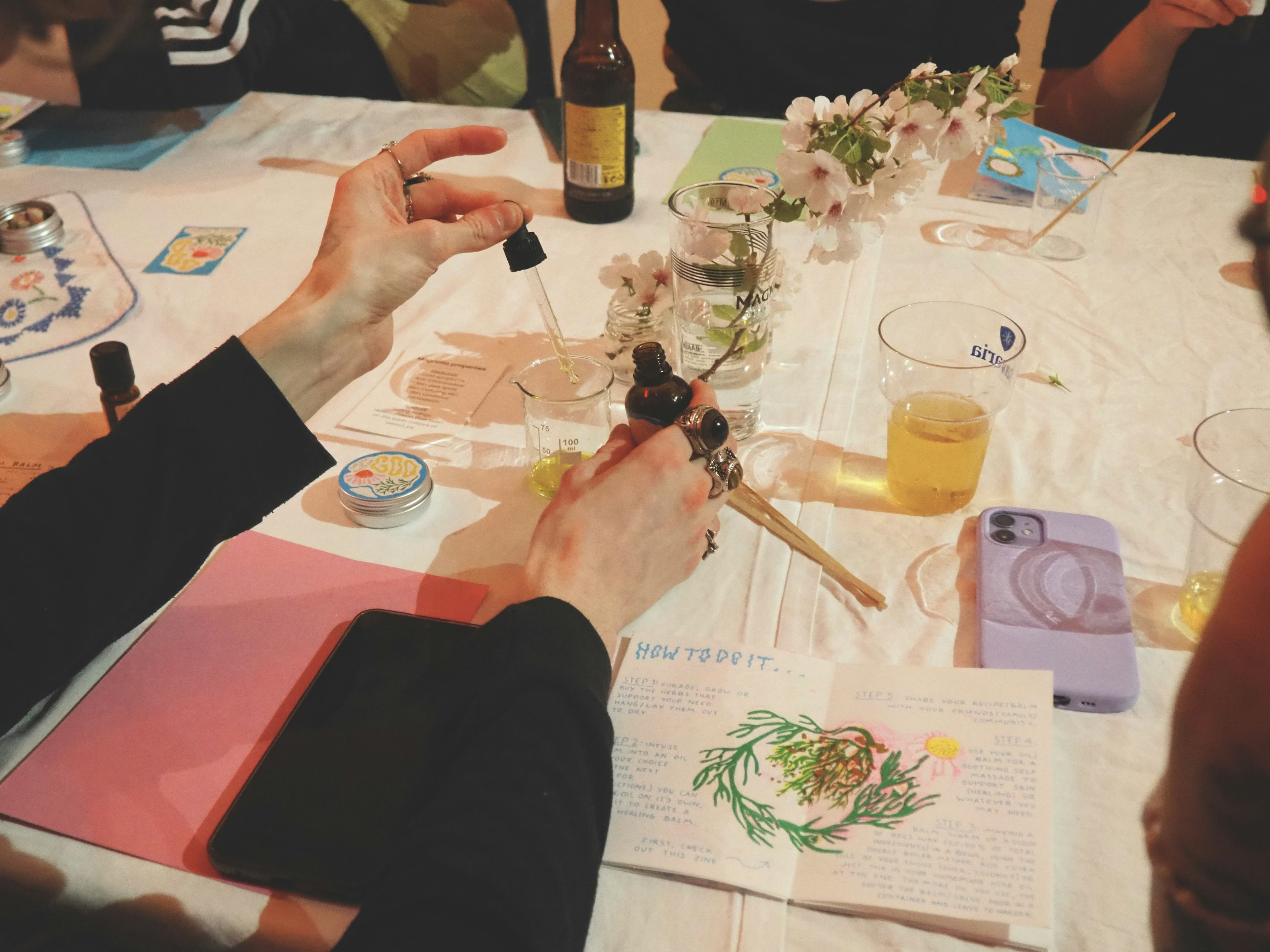 Workshop table with people working with flowers