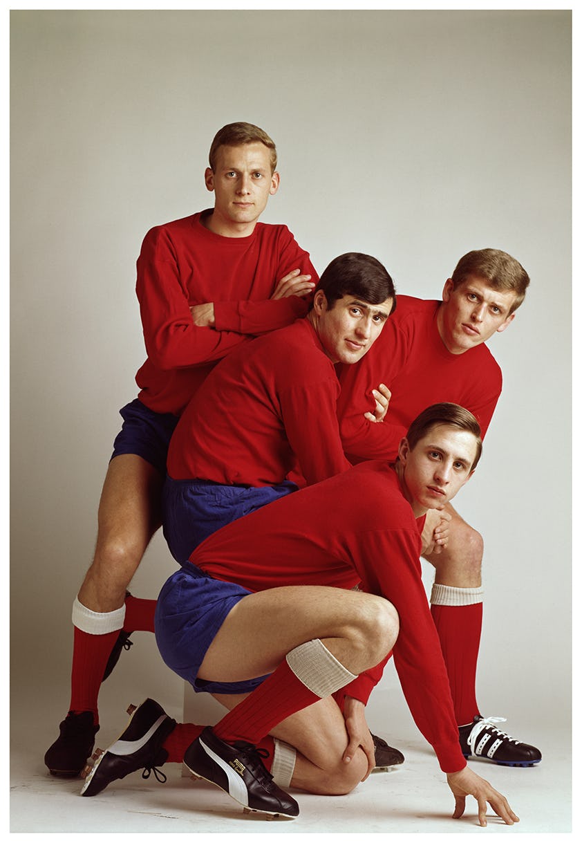 A group of Ajax football players wearing red t-shirts in a studio
