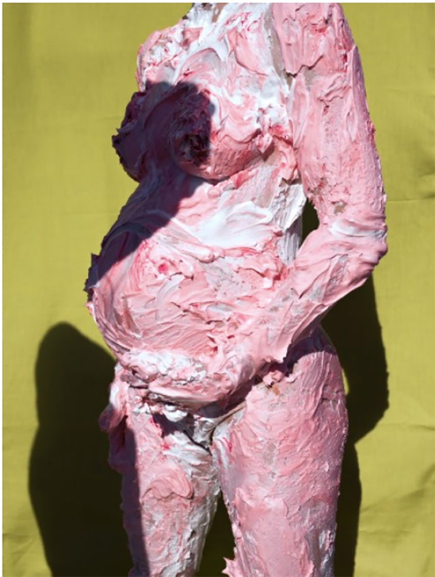 Pregnant woman covered in paint